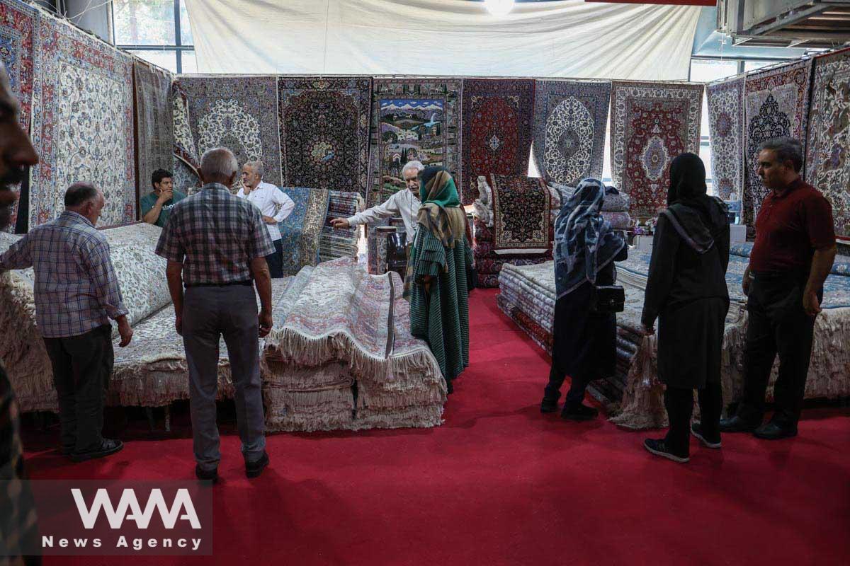 Iranians visit the 30th Handmade Carpet Exhibition in Tehran, Iran August 26, 2023. Majid Asgaripour/WANA (West Asia News Agency)