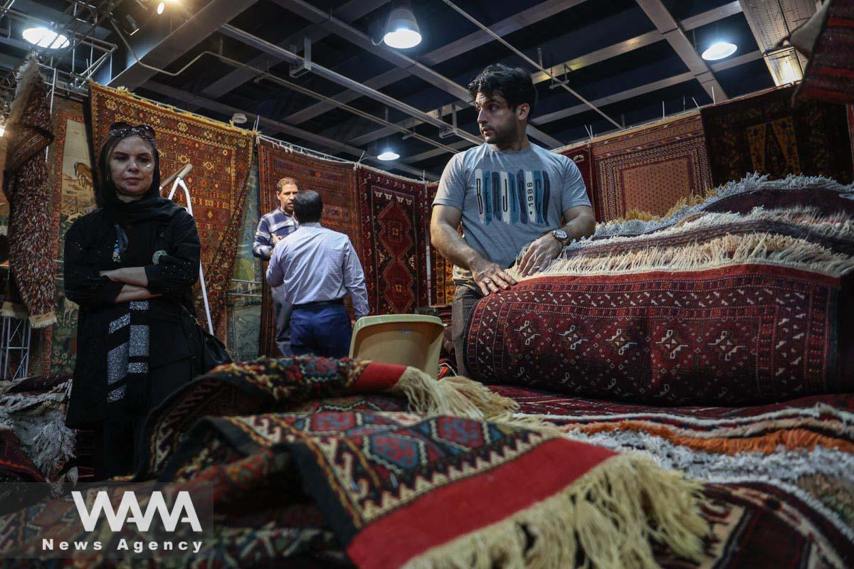 Iranians visit the 30th Handmade Carpet Exhibition in Tehran, Iran August 26, 2023. Majid Asgaripour/WANA (West Asia News Agency)