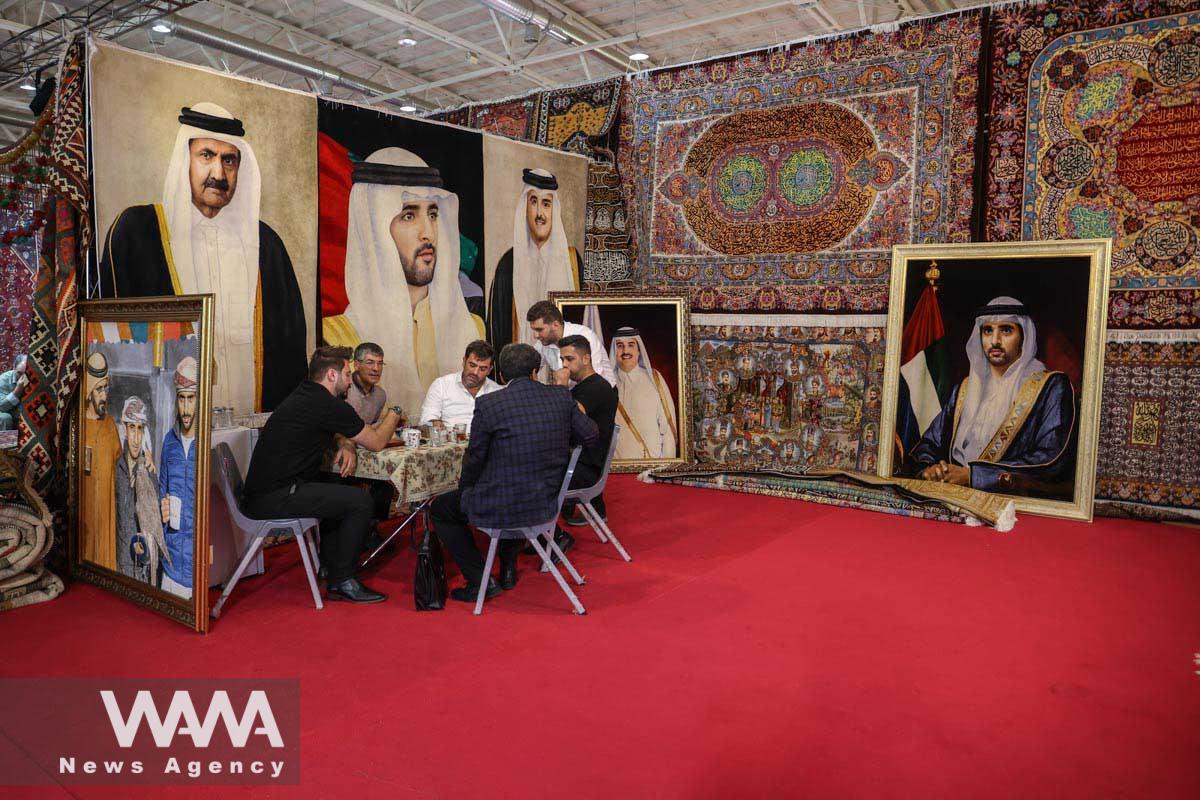 Tableau rugs with pictures of Arab leaders (Qatar and UAE) are seen during the 30th Handmade Carpet Exhibition in Tehran, Iran August 26, 2023. Majid Asgaripour/WANA (West Asia News Agency)