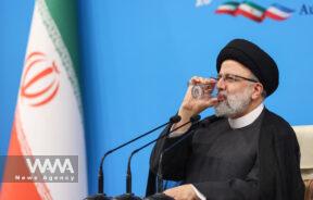 Iran's President Ebrahim Raisi drinks water during a news conference in Tehran, Iran August 29, 2023. Majid Asgaripour/WANA (West Asia News Agency)