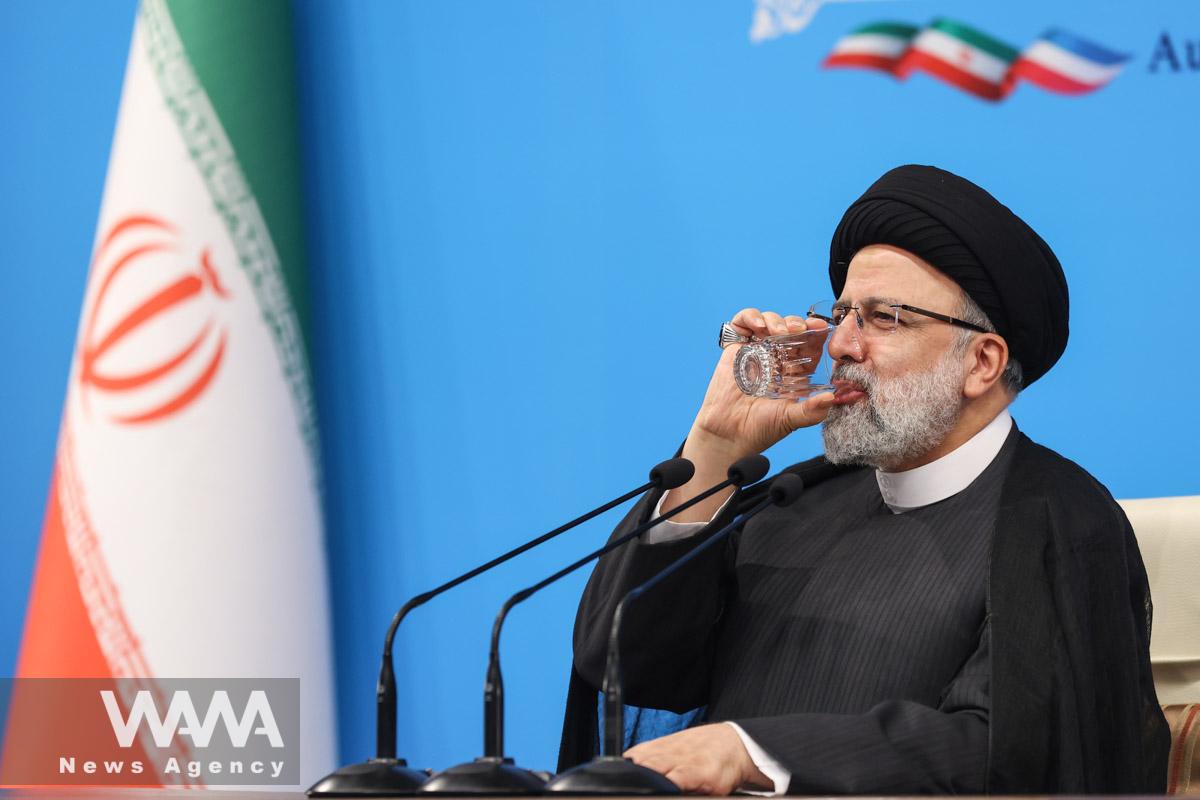 Iran's President Ebrahim Raisi drinks water during a news conference in Tehran, Iran August 29, 2023. Majid Asgaripour/WANA (West Asia News Agency)