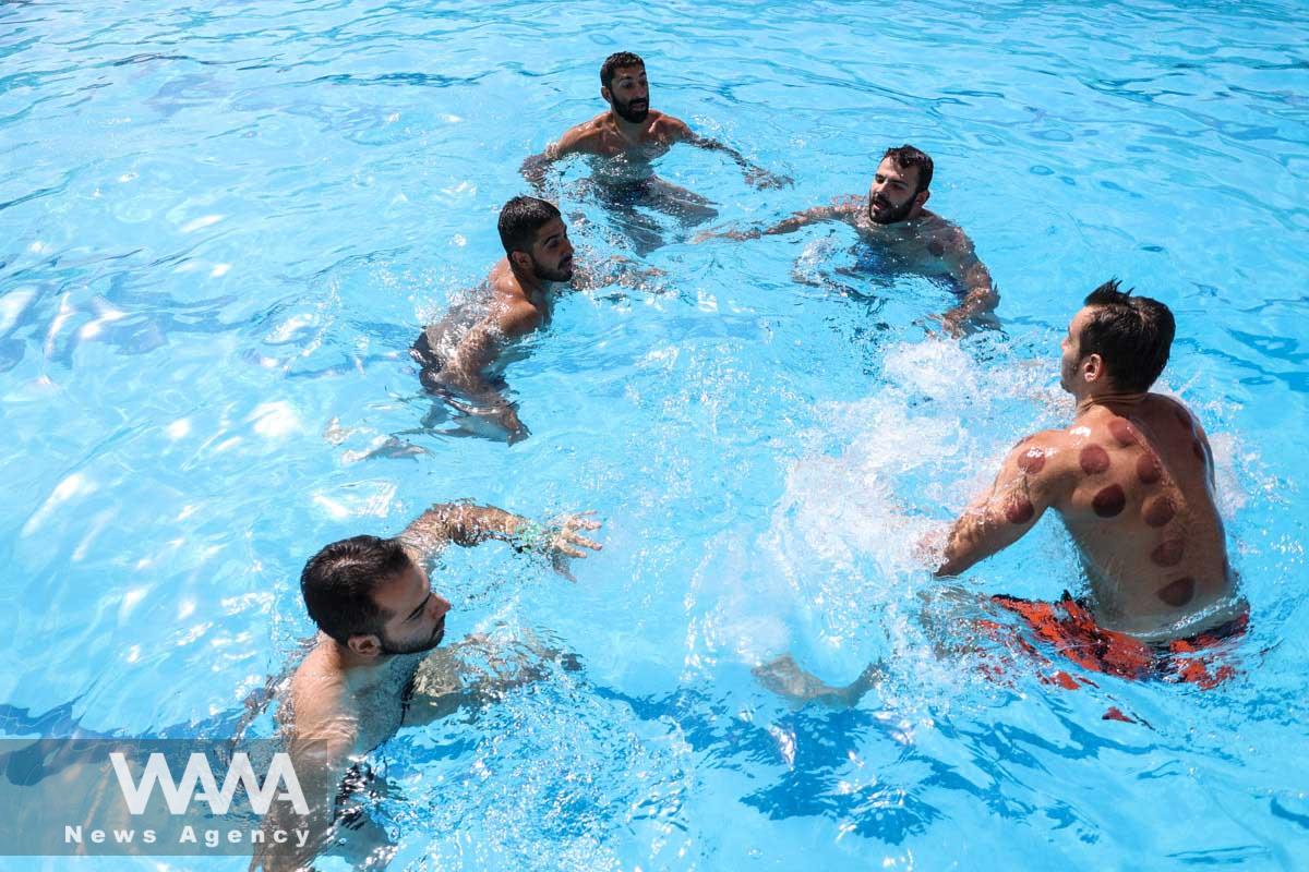 Iranians swim in a pool during the heat surge in Tehran, Iran August 3, 2023. Majid Asgaripour/WANA (West Asia News Agency)