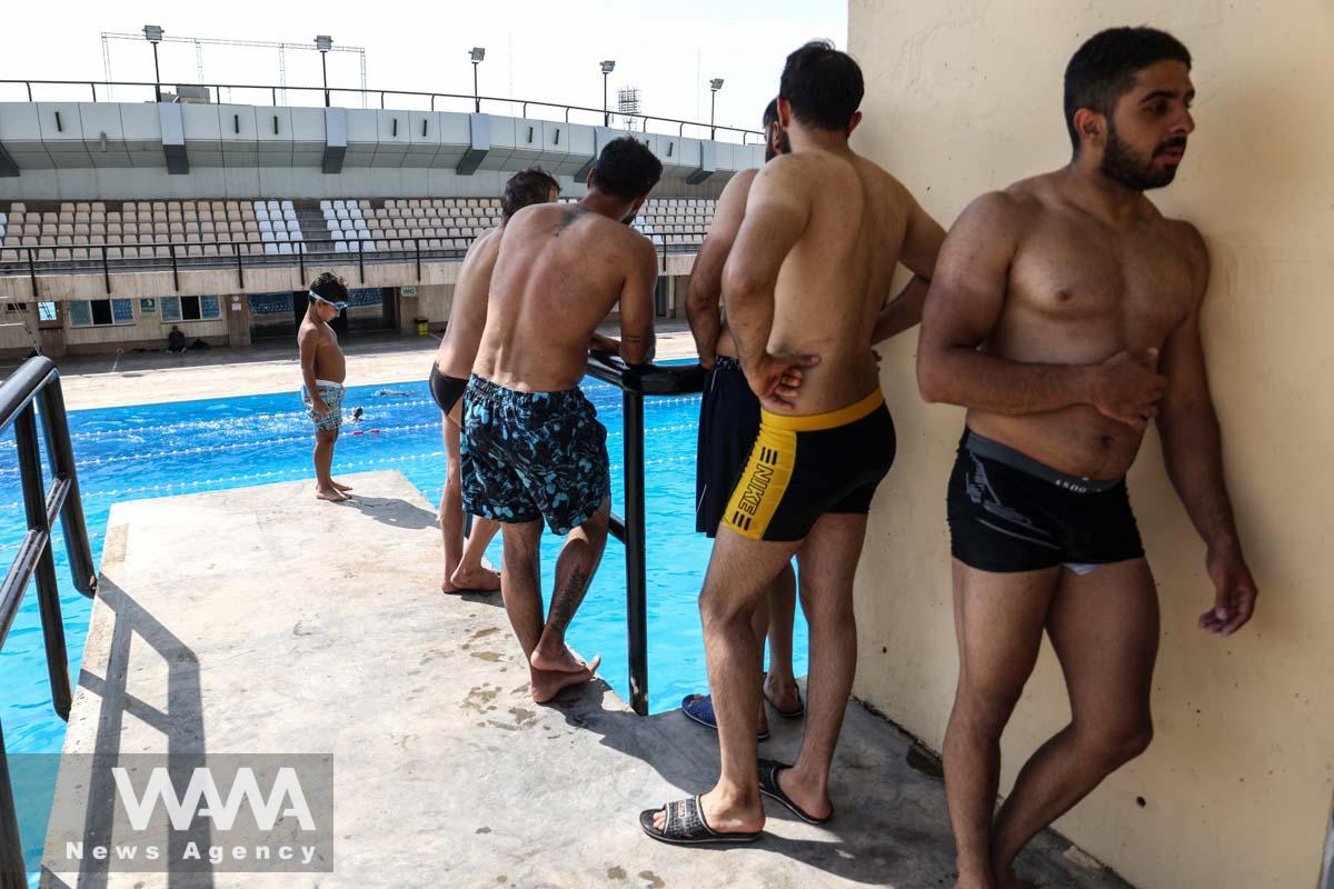 Iranians in a pool during the heat surge in Tehran, Iran August 3, 2023. Majid Asgaripour/WANA (West Asia News Agency)
