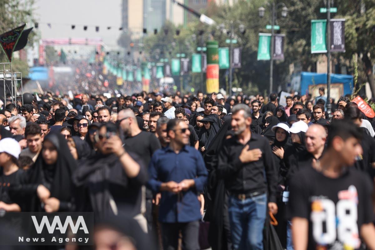Iranian people walk as they commemorate Arbaeen in southern Tehran, Iran September 6, 2023. Majid Asgaripour/WANA (West Asia News Agency)