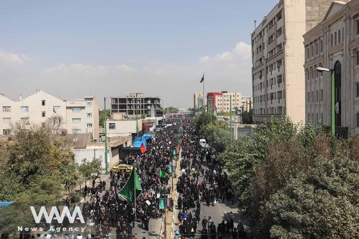 Iranian people walk as they commemorate Arbaeen in southern Tehran, Iran September 6, 2023. Majid Asgaripour/WANA (West Asia News Agency)