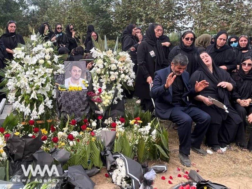 Javad Rouhi's funeral ceremony and his parents are mourning at his grave. North of Iran. Social Media. WANA News Agency