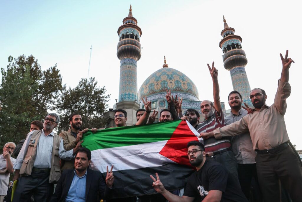 Iranian celebrate during a gathering in support of Palestinians, in Tehran, Iran, October 7, 2023. Majid Asgaripour/WANA (West Asia News Agency)