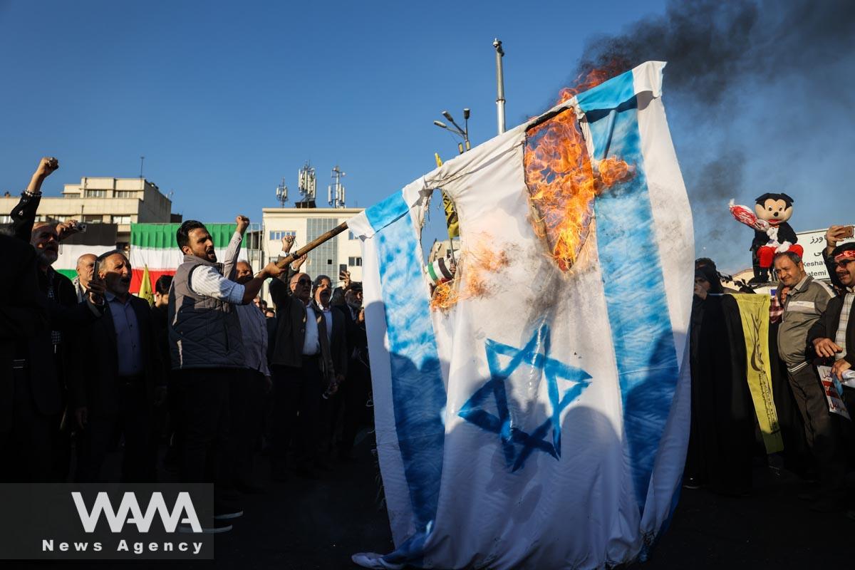 Protesters burn the Israeli flag during an anti-Israel protest in Tehran/WANA (West Asia News Agency)