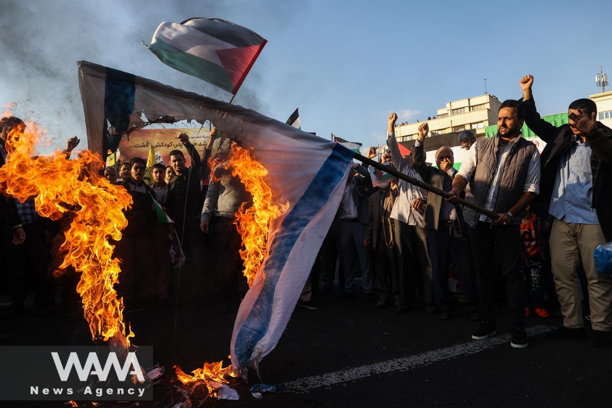 Protesters burn the Israeli flag during an anti-Israel protest in Tehran/WANA (West Asia News Agency)