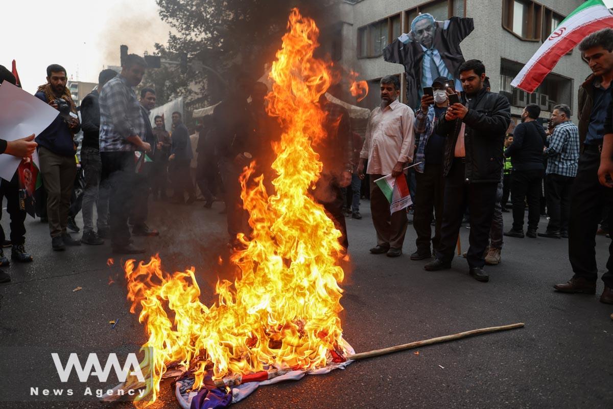 Iranians burn a replica of Israeli Prime Minister Benjamin Netanyahu during the 44th anniversary of the U.S. expulsion from Iran, in Iran/WANA (West Asia News Agency)