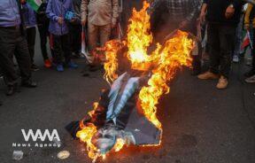 Iranians burn a replica of Israeli Prime Minister Benjamin Netanyahu during the 44th anniversary of the U.S. expulsion from Iran, in Iran/