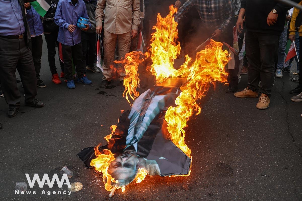Iranians burn a replica of Israeli Prime Minister Benjamin Netanyahu during the 44th anniversary of the U.S. expulsion from Iran, in Iran/