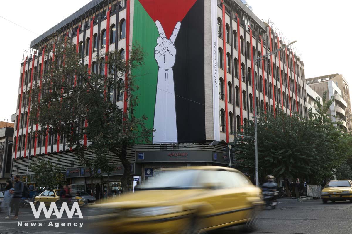A huge Palestinian flag is seen on a building in a street in Tehran/WANA (West Asia News Agency)