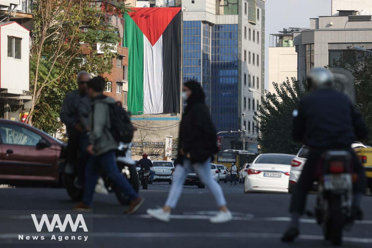 A huge Palestinian flag is seen on a building in a street in Iran/WANA (West Asia News Agency)