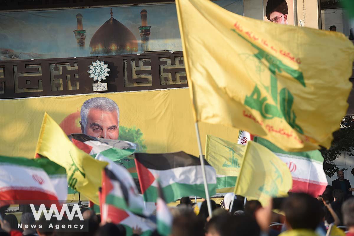 A banner with a photo of the late Iranian Major-General Qassem Soleimani is seen during a gathering in support of Palestinians, in Iran/WANA (West Asia News Agency)