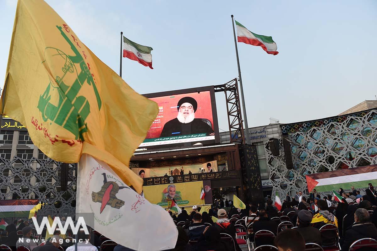 Supporters of Palestine listen to Hezbollah leader Sayyed Hassan Nasrallah's speech via a screen during a gathering in support of Palestinians, in Tehran/WANA (West Asia News Agency)