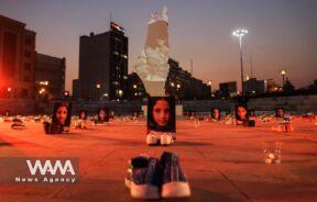 Symbolic shoes and pictures depicting deceased children in Gaza on display during a pro-Palestine campaign//WANA (West Asia News Agency)