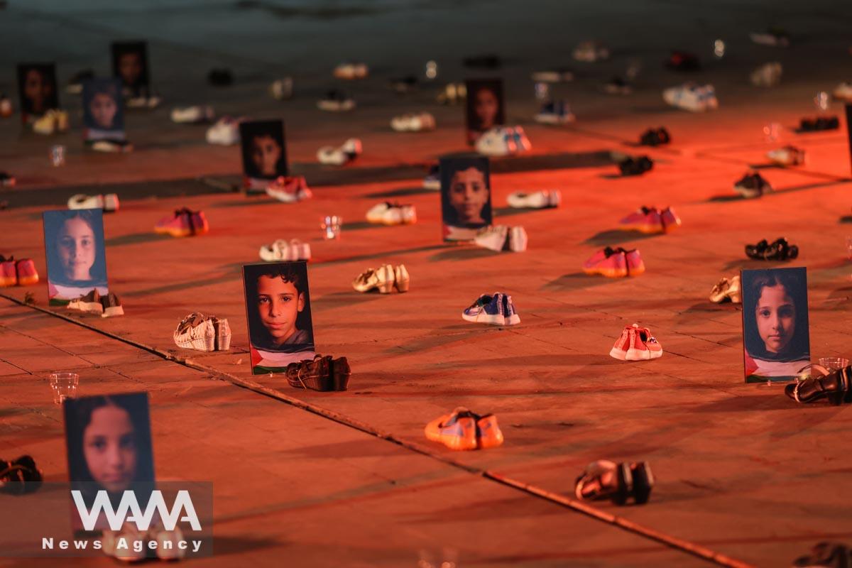 Symbolic shoes and pictures depicting deceased children in Gaza on display during a pro-Palestine campaign//WANA (West Asia News Agency)