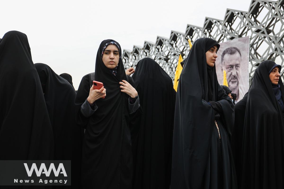 People gather for the funeral ceremony of senior adviser for Iran's Revolutionary Guards, Sayyed Razi Mousavi, who was killed in an Israeli air strike outside the Syrian capital Damascus