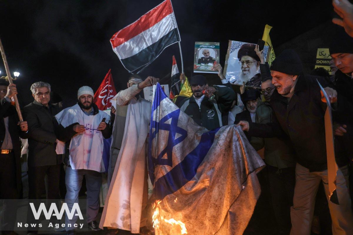 Protesters burn the Israeli flag during a gathering in support of Yemen in front of the British embassy in Iran/WANA (West Asia News Agency)