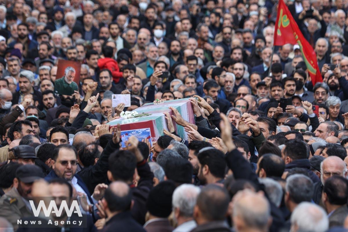 People carry the coffin of Faezeh Rahimi one of the casualties of the ISIS attack in Kerman during her funeral ceremony