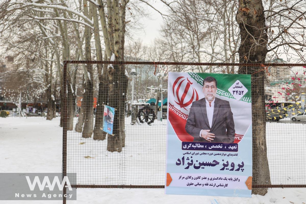 Parliamentary election campaign poster is seen during the last day of election campaigning