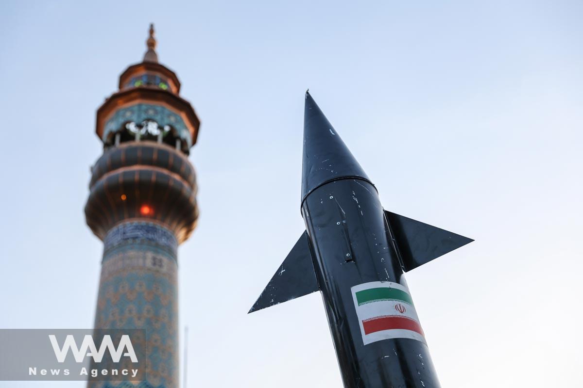 A model of a missile is seen during a celebration following the IRGC attack on Israel