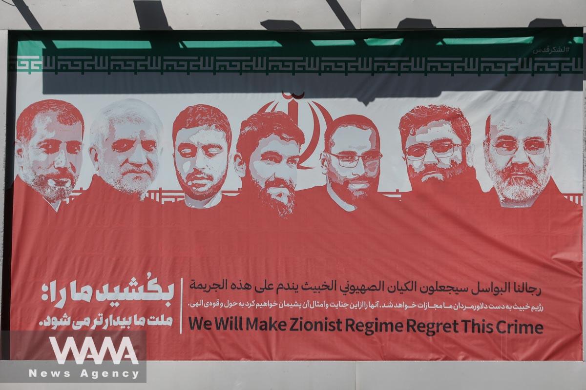 A billboard with a picture of members of the Islamic Revolutionary Guard Corps who were killed in a suspected Israeli airstrike on the Iranian embassy complex in the Syrian capital Damascus is seen in street in Tehran