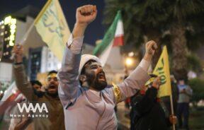 Iranians celebrate on a street, after the IRGC attack on Israel,
