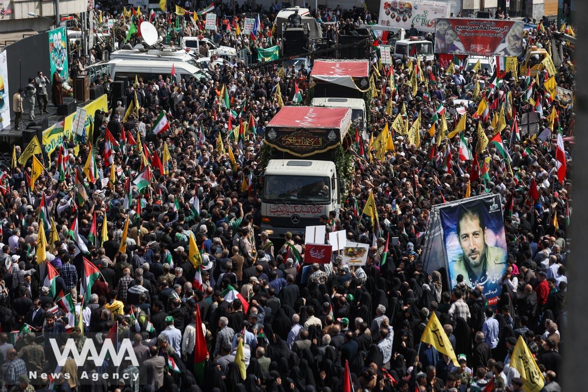 People gather for the funeral of members of the Islamic Revolutionary Guard Corps who were killed in the Israeli airstrike on the Iranian embassy complex in the Syrian capital Damascus, on the same day as Quds Day in Tehran