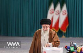 Iran's Supreme Leader Ayatollah Ali Khamenei arrives to cast his vote during runoff parliamentary elections