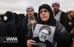 Mourners attend a funeral for victims of the helicopter crash that killed Iran's President Ebrahim Raisi, Foreign Minister Hossein Amirabdollahian and others, in Qom