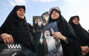 People gather to mourn for the death of the late Iran's President Ebrahim Raisi