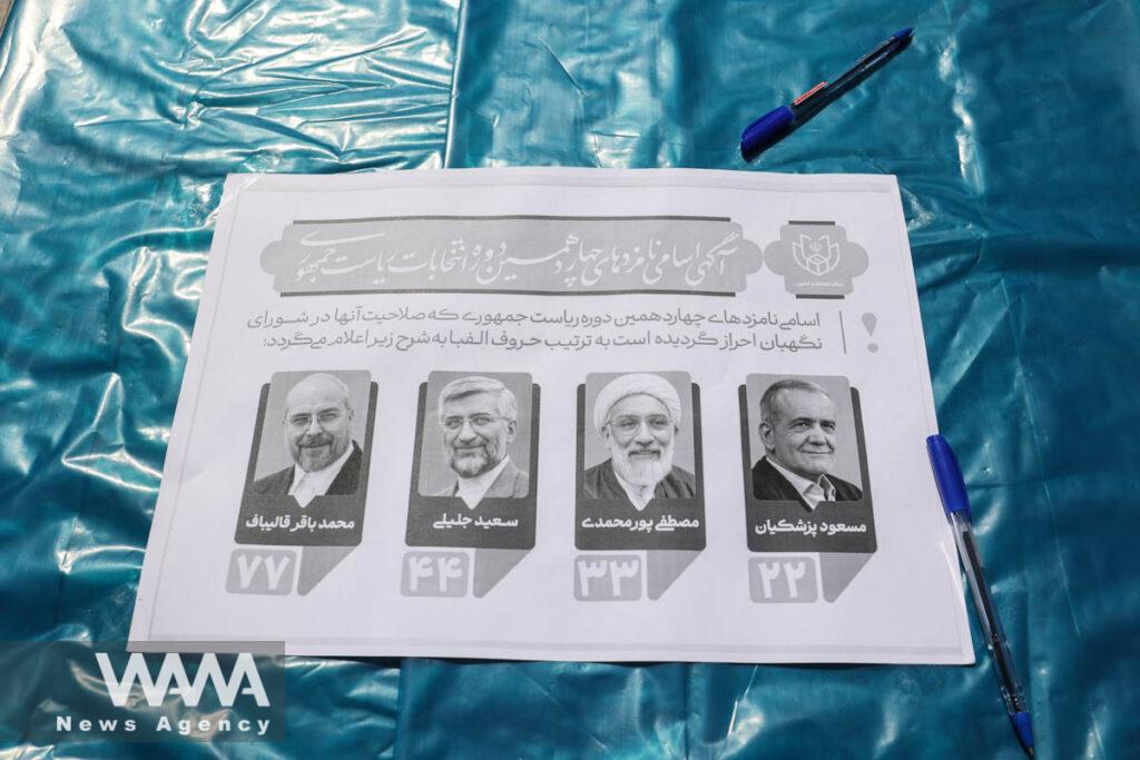 A paper showing the presidential candidates is pictured during the snap presidential election to choose a successor to Ebrahim Raisi following his death in a helicopter crash