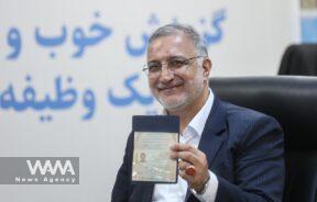 Alireza Zakani mayor of Tehran shows his identification document as he registers as a candidate for the presidential election at the Interior Ministry