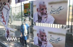 Posters of Iranian presidential candidate Saeed Jalili are seen on a street in Tehran