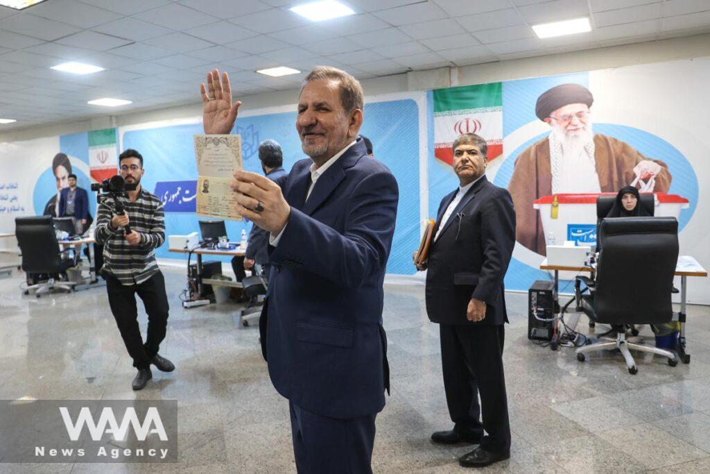 Eshaq Jahangiri, former senior vice president of Iran, show his identification document, as he registers as a candidate for the presidential election at the Interior Ministry