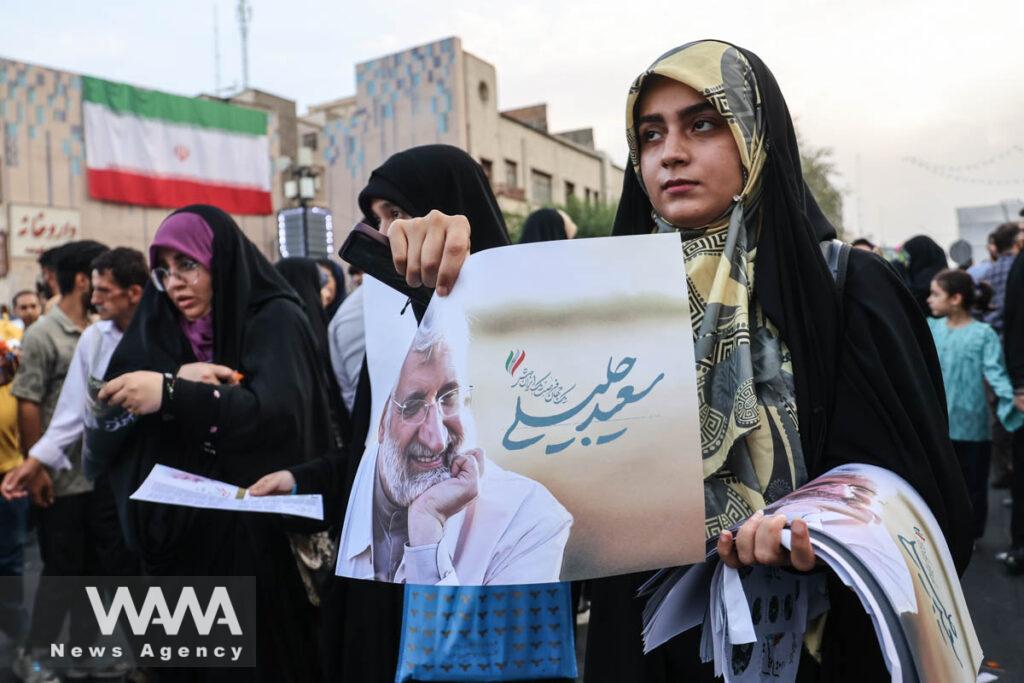 Supporters of Iranian presidential candidate Saeed Jalili attend the Ghadir Eid festival in Tehran