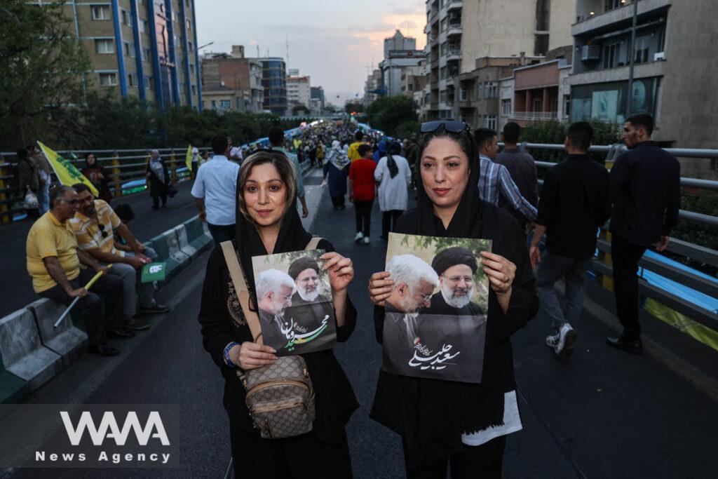 Supporters of Iranian presidential candidate Saeed Jalili attend the Ghadir Eid festival in Tehran