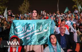 Supporters of Iranian presidential candidate Masoud Pezeshkian attend a campaign event in Tehran