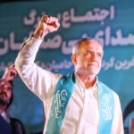 Iranian presidential candidate Masoud Pezeshkian waves during a campaign event in Tehran