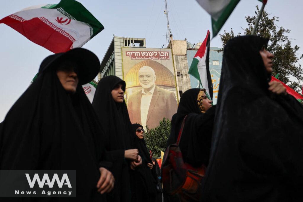 A billboard with a picture of Palestinian group Hamas' top leader Ismail Haniyeh, is displayed during an anti-Israel gathering following the killing of him, amid the ongoing conflict between Israel and Hamas, in Tehran, Iran July 31, 2024. Majid Asgaripour/WANA (West Asia News Agency)