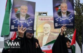 A billboard with a picture of Palestinian group Hamas' top leader Ismail Haniyeh, is displayed during an anti-Israel gathering following the killing of him, amid the ongoing conflict between Israel and Hamas, in Tehran, Iran July 31, 2024. Majid Asgaripour/WANA (West Asia News Agency)