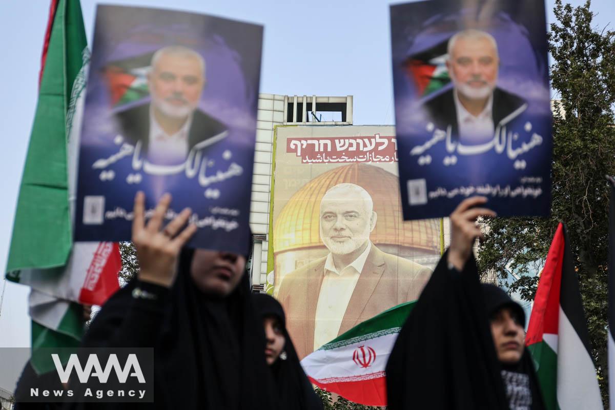 A billboard with a picture of Palestinian group Hamas' top leader Ismail Haniyeh, is displayed during an anti-Israel gathering following the killing of him, amid the ongoing conflict between Israel and Hamas, in Tehran, Iran July 31, 2024. Majid Asgaripour/WANA (West Asia News Agency)