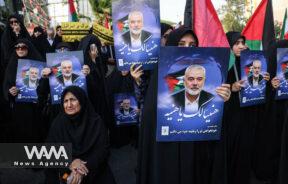 People hold posters of Palestinian group Hamas' top leader Ismail Haniyeh, during an anti-Israel gathering following the killing of him, amid the ongoing conflict between Israel and Hamas, in Tehran, Iran July 31, 2024. Majid Asgaripour/WANA (West Asia News Agency)