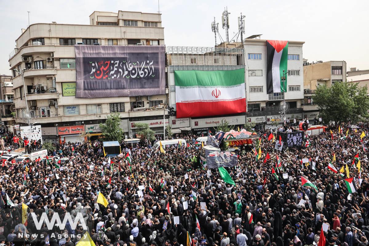 Iranians attend the funeral procession of assassinated Hamas chief, Ismail Haniyeh in Tehran