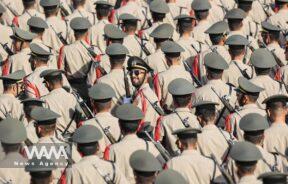 Iranian armed forces members march during the annual military parade