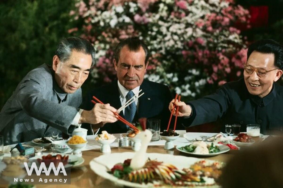 Richard Nixon, the then-President of the United States, using chopsticks while Zhou Enlai, the Premier of China, and Zhang Chunqiao, a leader of the Communist Party in Shanghai, hold their chopsticks in front of him during a banquet in China in 1972 . Social Media / WANA News Agency