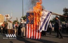 Iranians burn a U.S. flag during an anti-Israel gathering