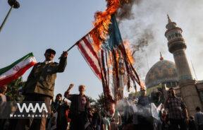 Iranians burn a U.S. flag during an anti-Israel gathering